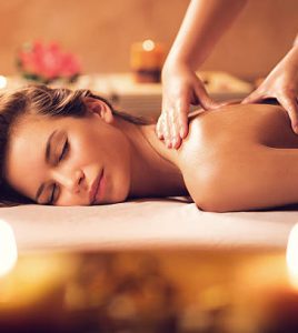 Beautiful woman receiving back massage at the spa.